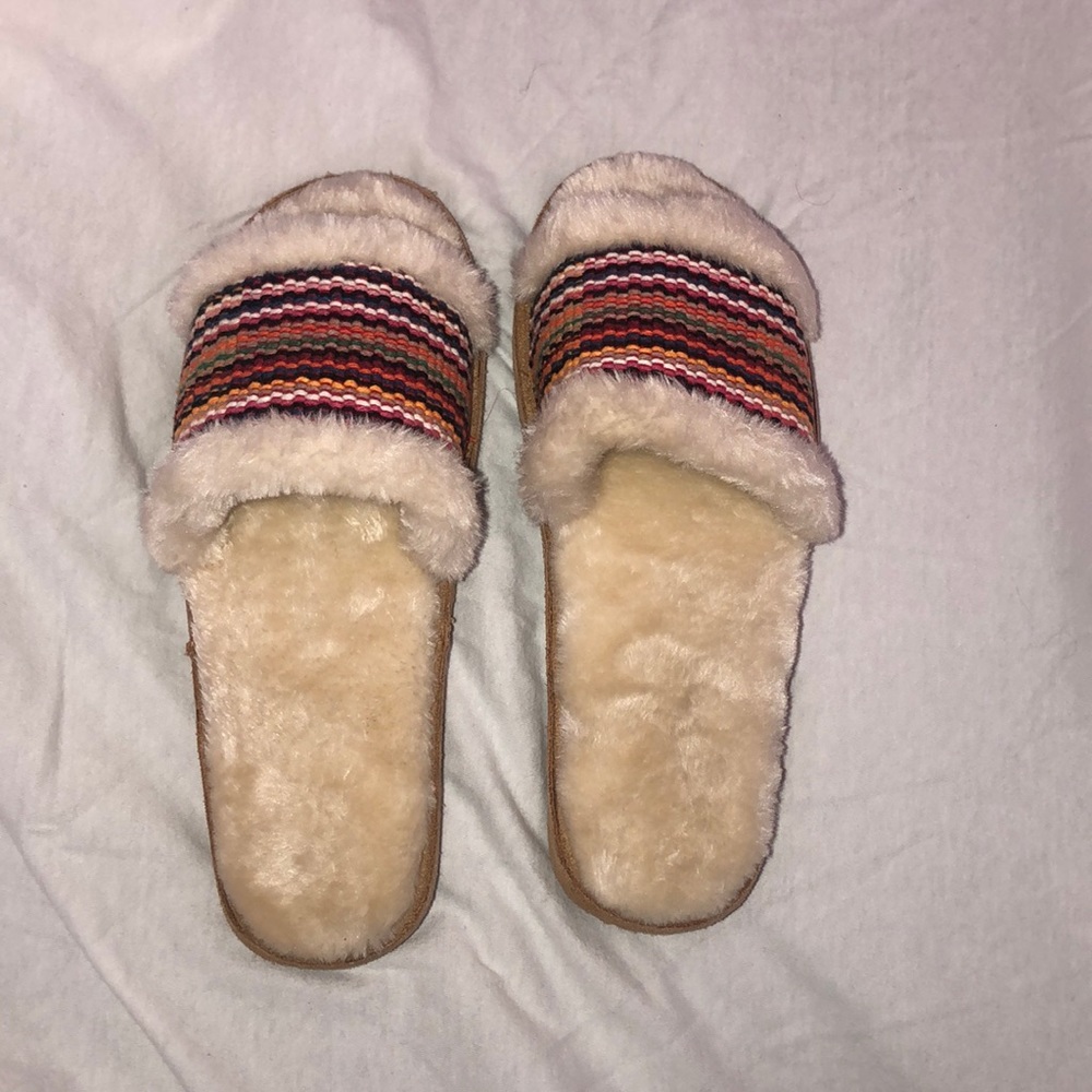 Never worn Minnetonka slippers